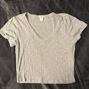 Light gray crop top, Never been worn before. Size large ( runs small )